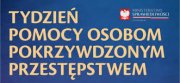 Plakat - na niebieskim tle napis  Tydzień Pomocy Osobom Pokrzywdzonym Przestępstwem