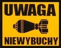 na grafice napis uwaga niewybuchy i pocisk na żółtym tle