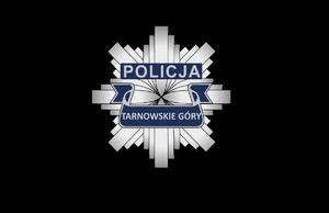 na zdjęciu logo policji w formie policyjnej odznaki z napisem tarnowskie góry pomagamy i chronimy