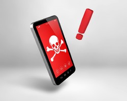 na zdjęciu animowany telefon z wizerunkiem czaszki na czerwonym tle, obok czerwony wykrzyknik